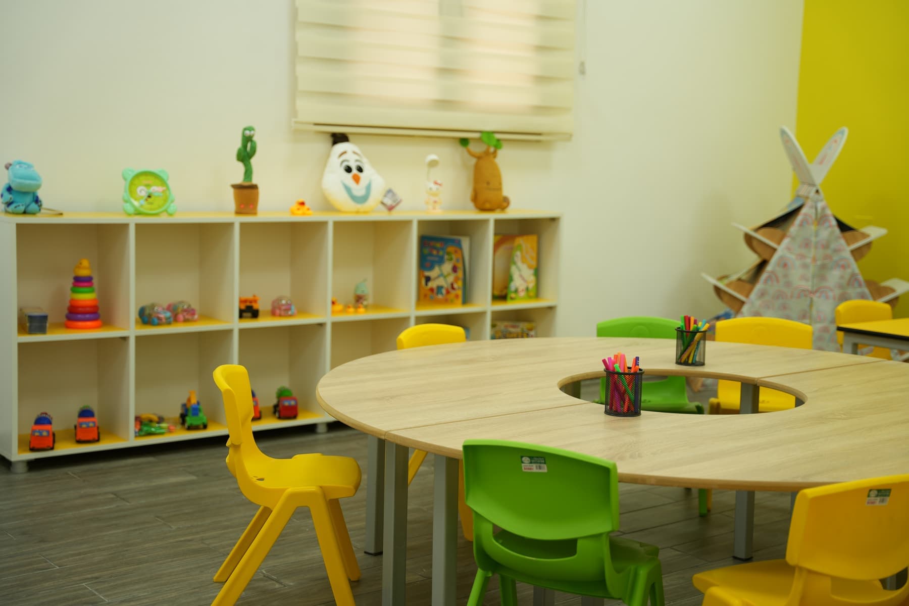 An activity room with a round shared table
